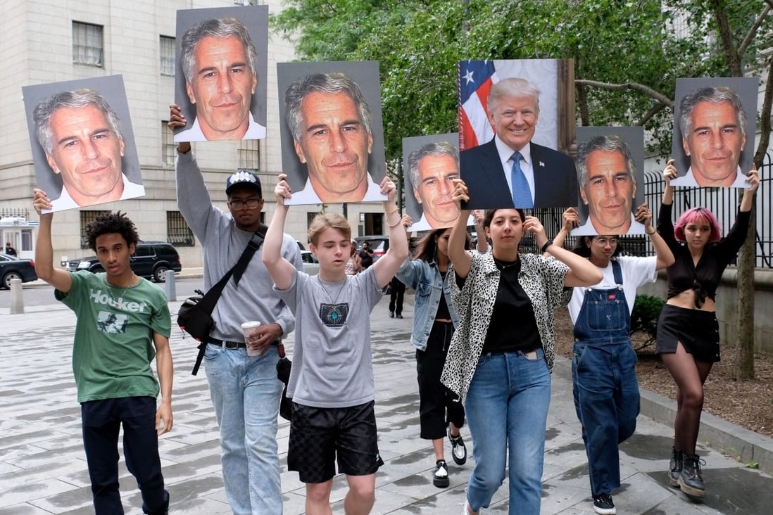 Protesters hold pictures of Jeffrey Epstein and Donald Trump in Manhattan in 2019. Photo: New York Daily News / TNS