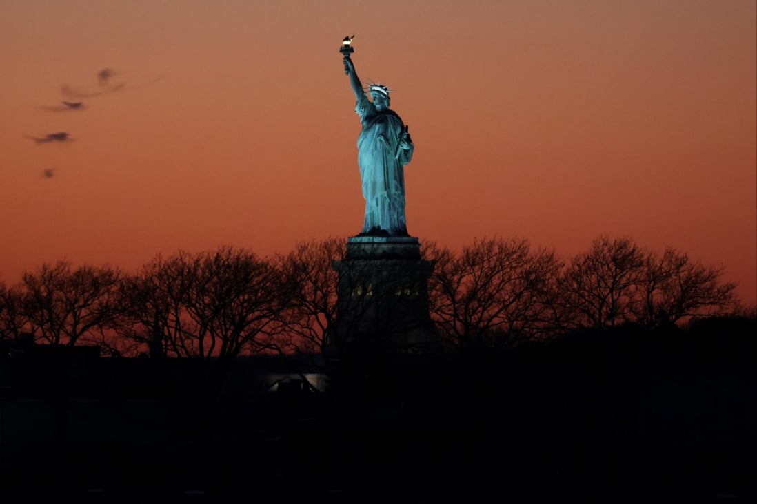 The Statue of Liberty seen at sunset in New York City. Photo: Reuters