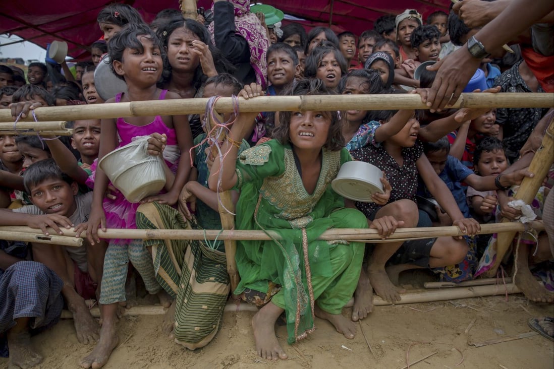 Rohingya children wait for food aid at a refugee camp in Bangladesh in 2017 after fleeing the violence in Myanmar. Photo: AP