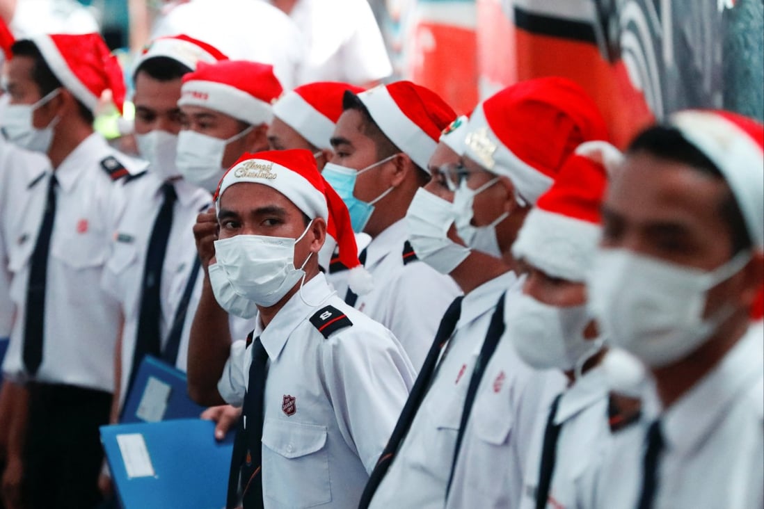 Members of a choir get ready to sing Christmas songs in Jakarta, Indonesia, on Wednesday. Photo: Reuters