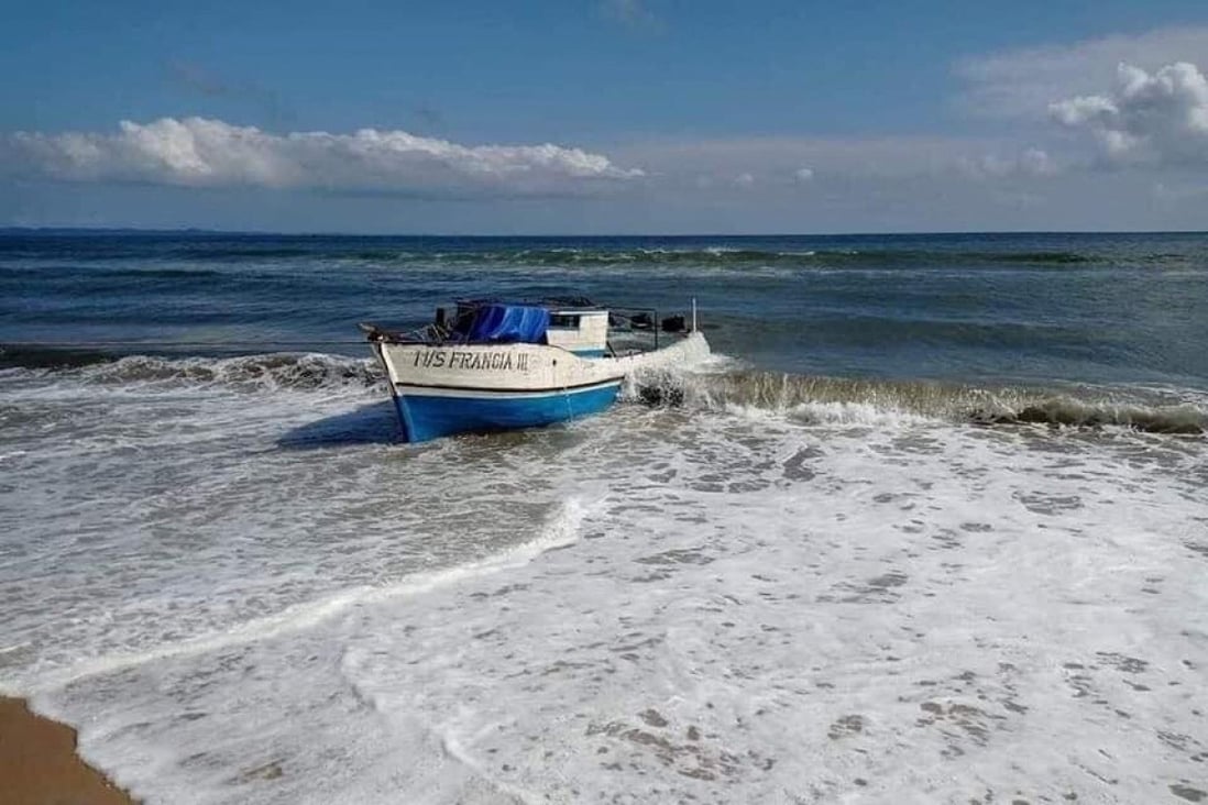 The wreck of the boat that sank off the coast of Madagascar on Monday is pulled to the beach. Photo: Madagascar Ministry of National Defence via Reuters