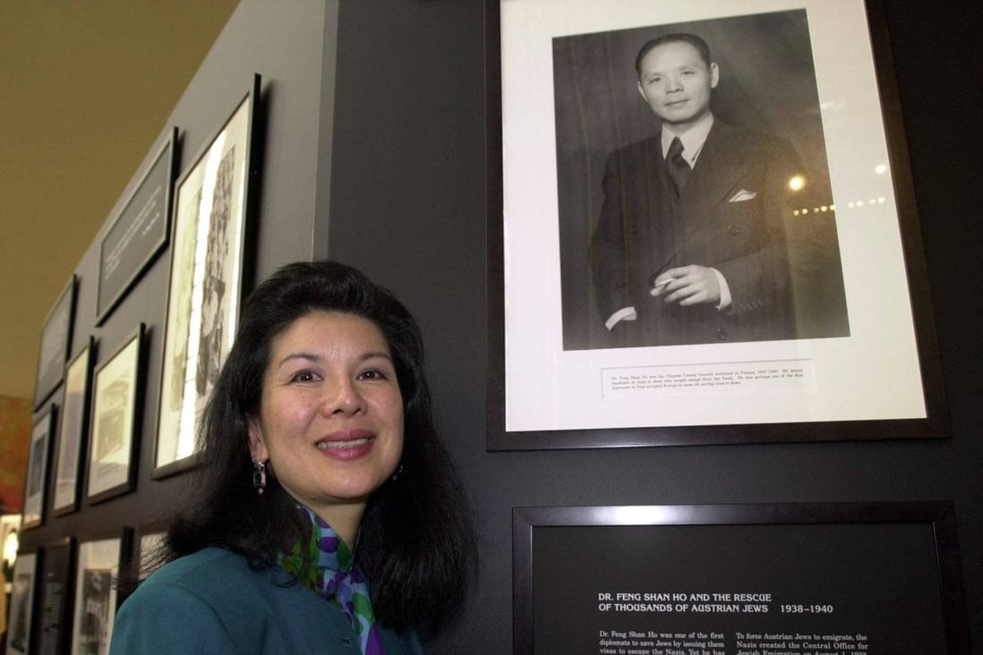Manli Ho poses next to a photograph of her father, Dr Ho Feng-shan. Photo: AFP
