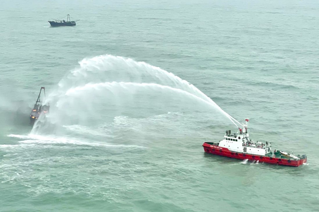 Authorities attempt to extinguish a blaze aboard a Hong Kong fishing vessel that ultimately sank off Sai Kung. Photo: Government Flying Service