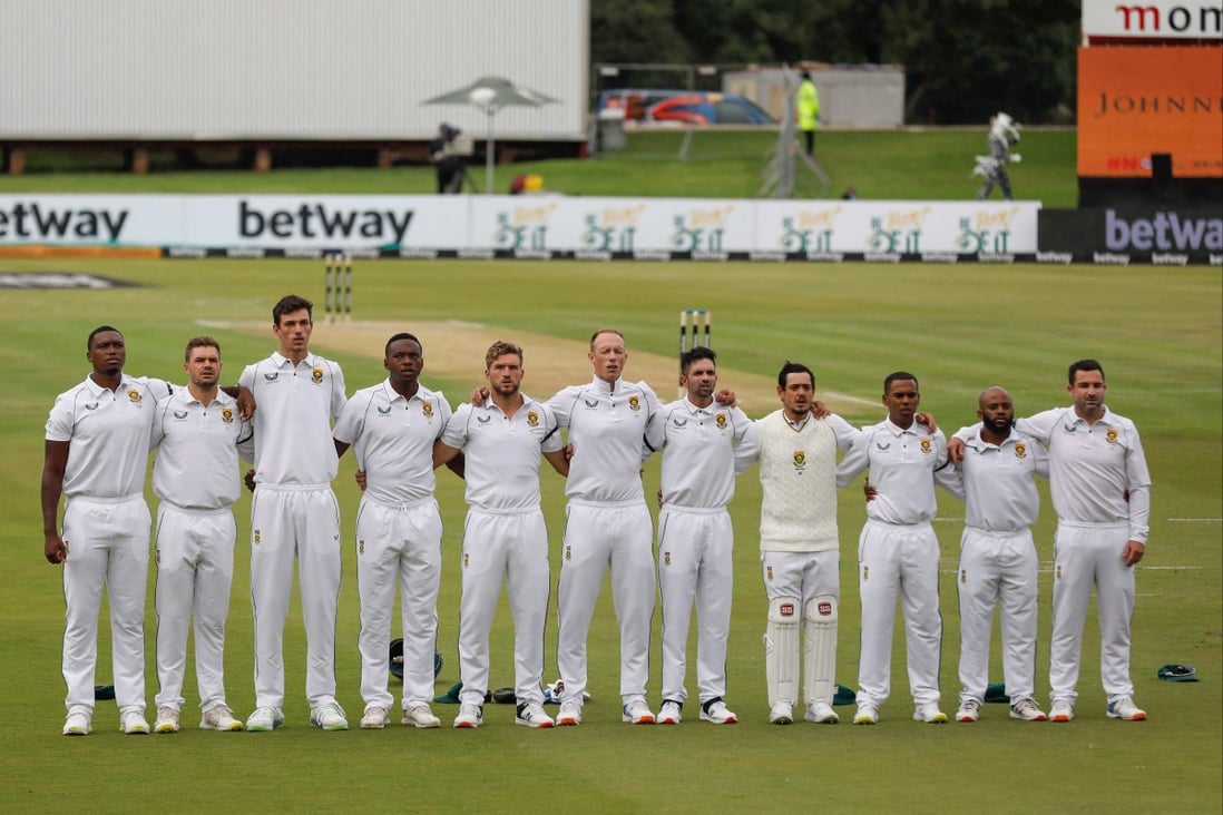 South Africa players sing the national anthem as they wear black armbands to mourn the death of anti-apartheid icon Archbishop Desmond Tutu. Photo: AFP