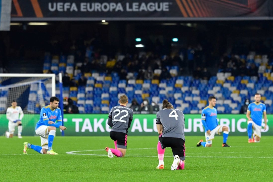 Players of Napoli and Leicester take a knee before a Europa League match in Naples. Photo: AFP