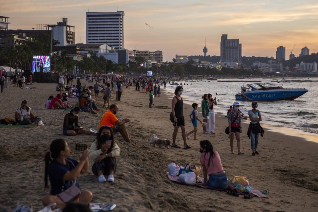 Tourists on Central Pattaya Beach, Thailand, in December. Other than for  arrivals in Phuket, the country suspended its experiment in allowing quarantine-free entry to vaccinated visitors when the Omicron Covid-19 variant became a threat. Photo: Lauren DeCicca/Getty Images