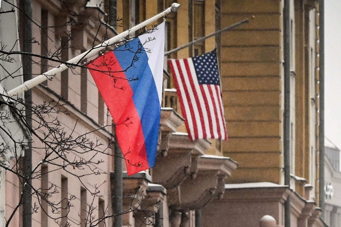 Russian and American flags fly outside the US embassy building in Moscow. Photo: AFP