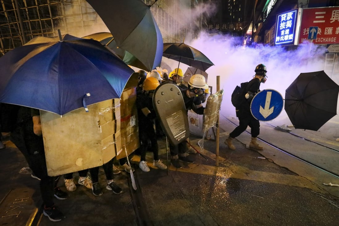 Protesters set up defences around Central and Sheung Wan as riot police fire tear gas on July 28, 2019. Photo: James Wendlinger