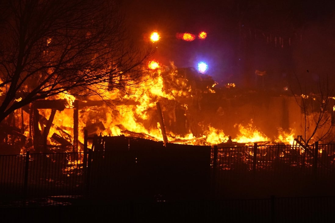 Homes burn as wildfires rip through a development in Superior, Colorado. Photo: AP Photo