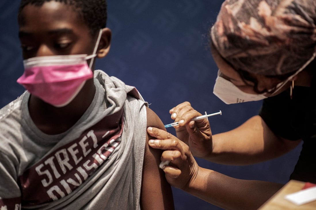 A boy receives a dose of the Pfizer/BioNTech vaccine in Johannesburg. Photo: AFP via Getty Images/TNS 