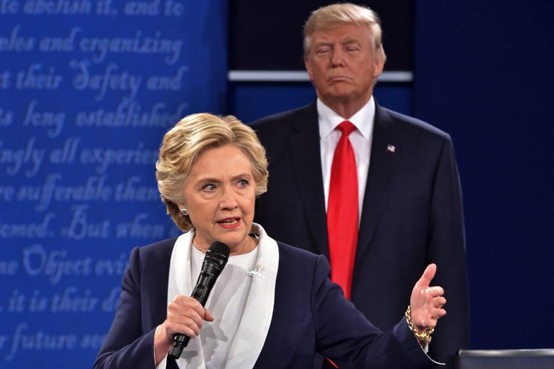 Then Republican presidential candidate Donald Trump listens to Democratic presidential candidate Hillary Clinton during the second presidential debate at Washington University in St Louis, Missouri, in October 2016. Photo: AFP