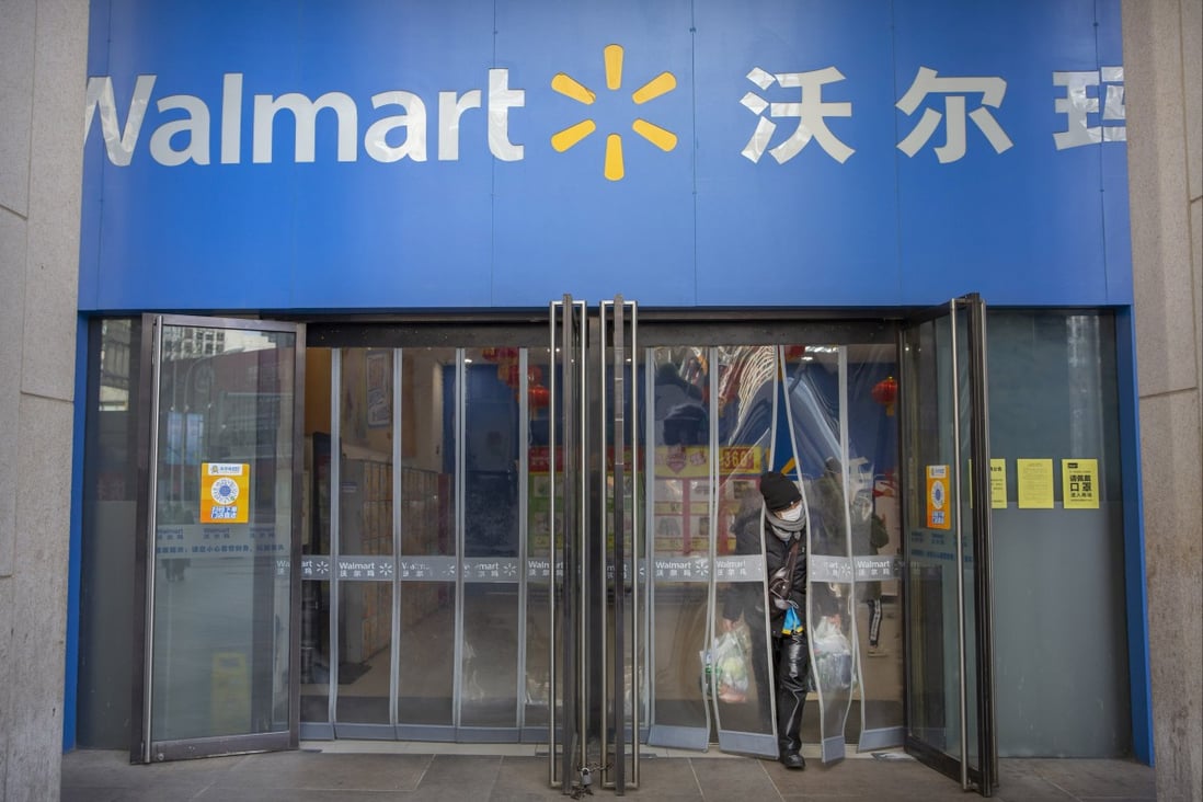 A woman wearing a mask is pictured at a Walmart grocery store in Beijing. In a statement on its website, China’s CCDI accused Sam’s Club of boycotting Xinjiang products. Photo: AP