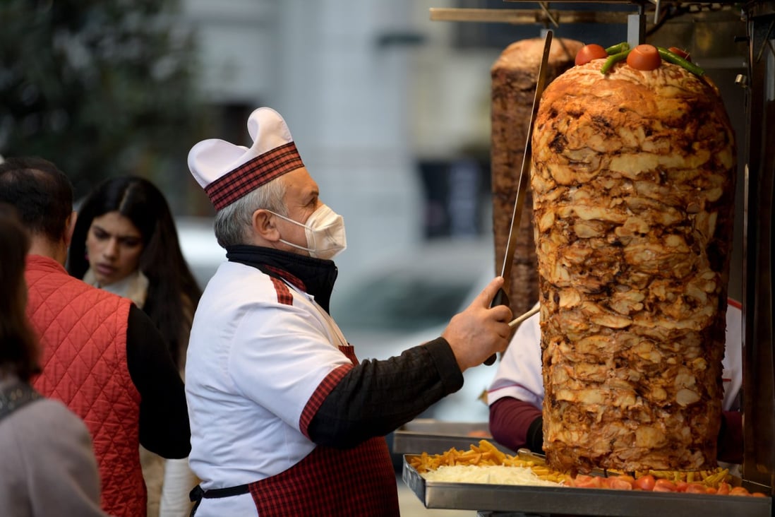 A chef works at a food booth in Istanbul, Turkey, on December 29. Turkey’s annual inflation rate is expected to have hit 30.6 per cent in December, according to a Reuters poll, breaching the 30 per cent level for the first time since 2003 as prices rose due to record lira volatility. Photo: Xinhua