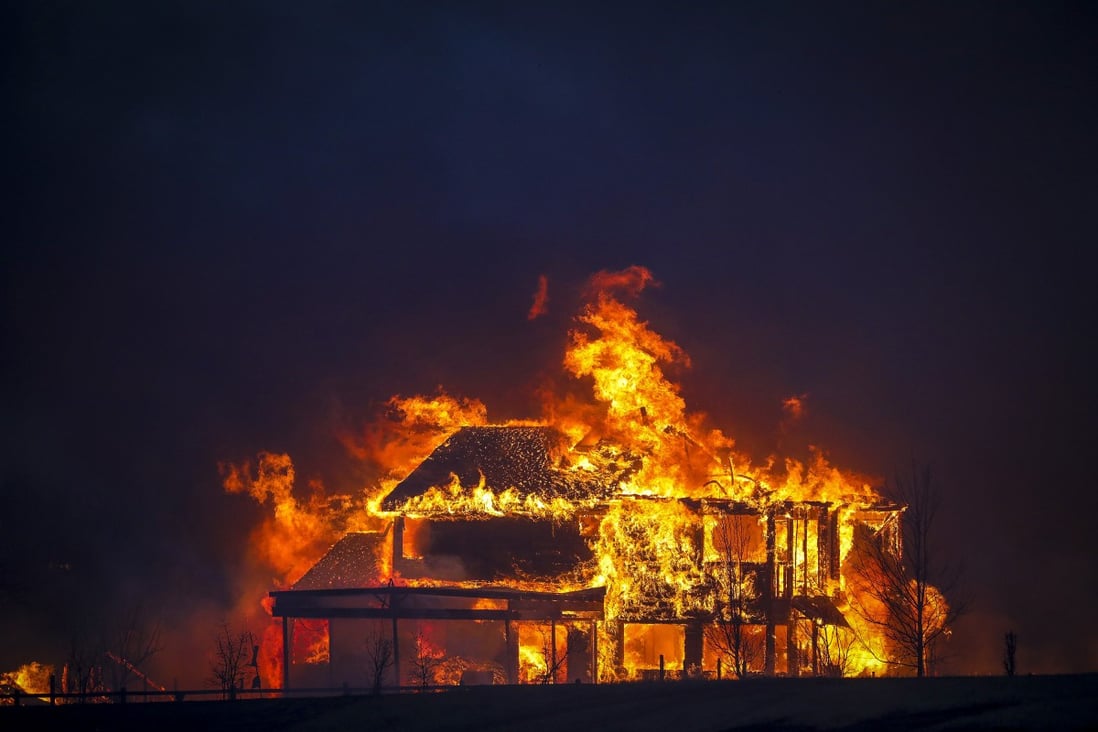 A home burns after a fast-moving fire swept through Louisville, Colorado on December 30. Photo: Getty Images / TNS