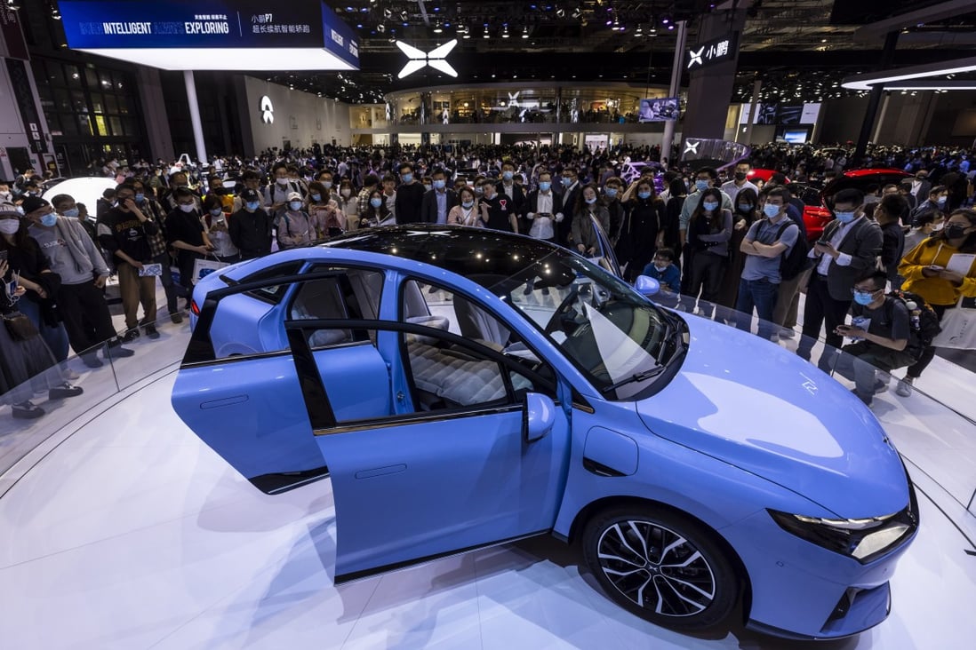 People check out Xpeng Motors’ P5 electric car on display during the Auto Shanghai 2021 trade show in April last year. Photo: EPA-EFE
