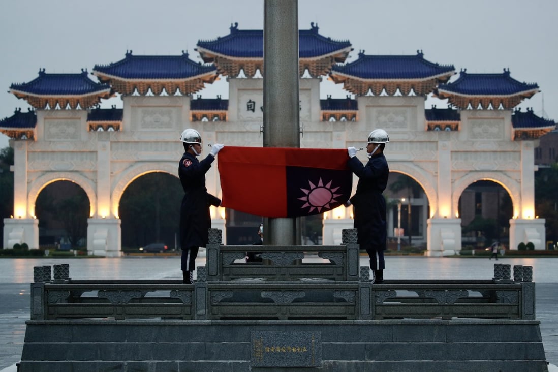 Taiwanese honour guards with the island’s flag at Liberty Square in Taipei. Photo: EPA-EFE 