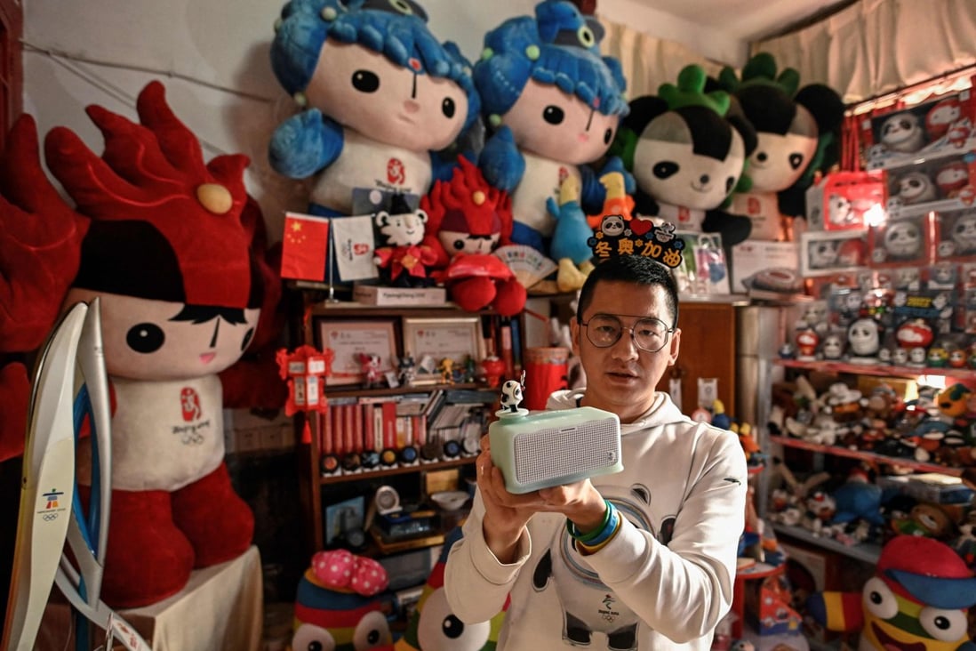 Olympic superfan Zhang Wenquan shows his collection of Olympic souvenirs at home in Beijing. Crammed on every available surface is Olympic memorabilia. Photo: AFP