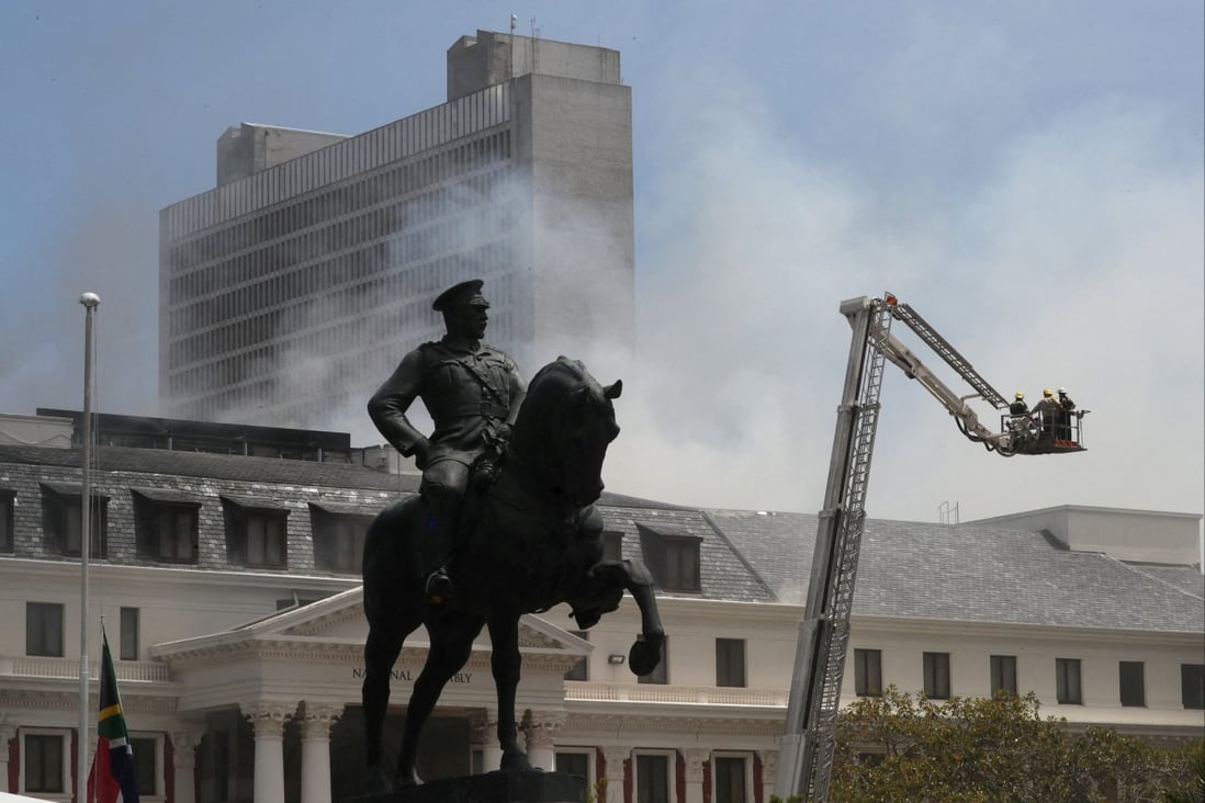 A statue of Louis Botha, former prime minister of the Union of South Africa, in front of the parliament where a fire broke out in Cape Town, on January 2. A man has been charged with arson. Photo: Reuters