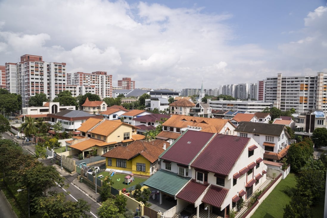 Private residential houses and Housing & Development Board (HDB) public housing estates in the Hougang area of Singapore on December 22, 2021. Photo: Bloomberg