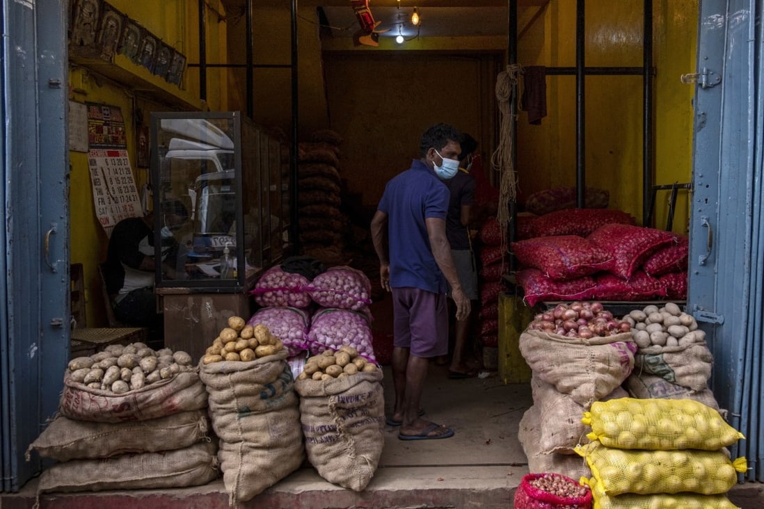 Sacks of potatoes and onions are seen in a store at Pettah Market in Colombo, Sri Lanka. Prices of essential items have surged in the island nation as it runs out of foreign exchange to pay for imports.  Photo: Bloomberg