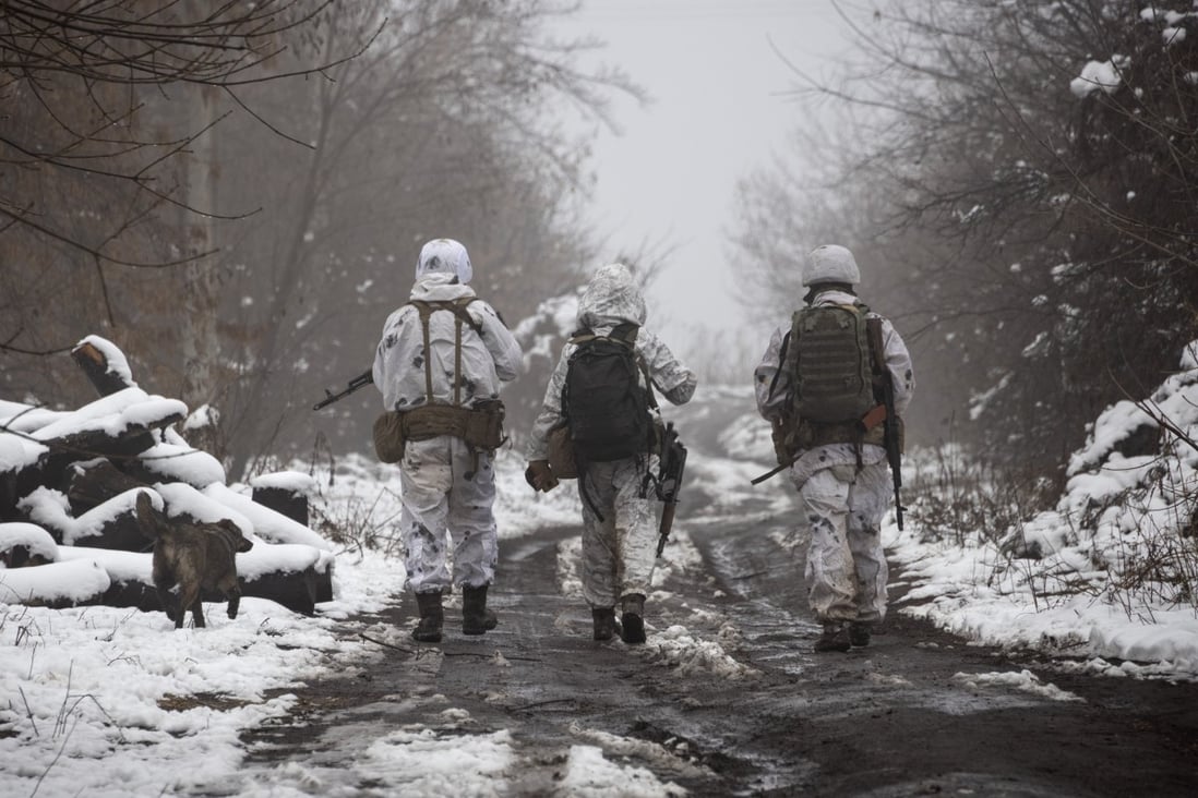 Ukrainian soldiers walk along a line of separation from pro-Russian rebels near Katerinivka, Donetsk region, Ukraine, on December 7. America’s increased focus on competition with China could create an opening for Russia to exploit in its dispute with Ukraine. Photo: AP