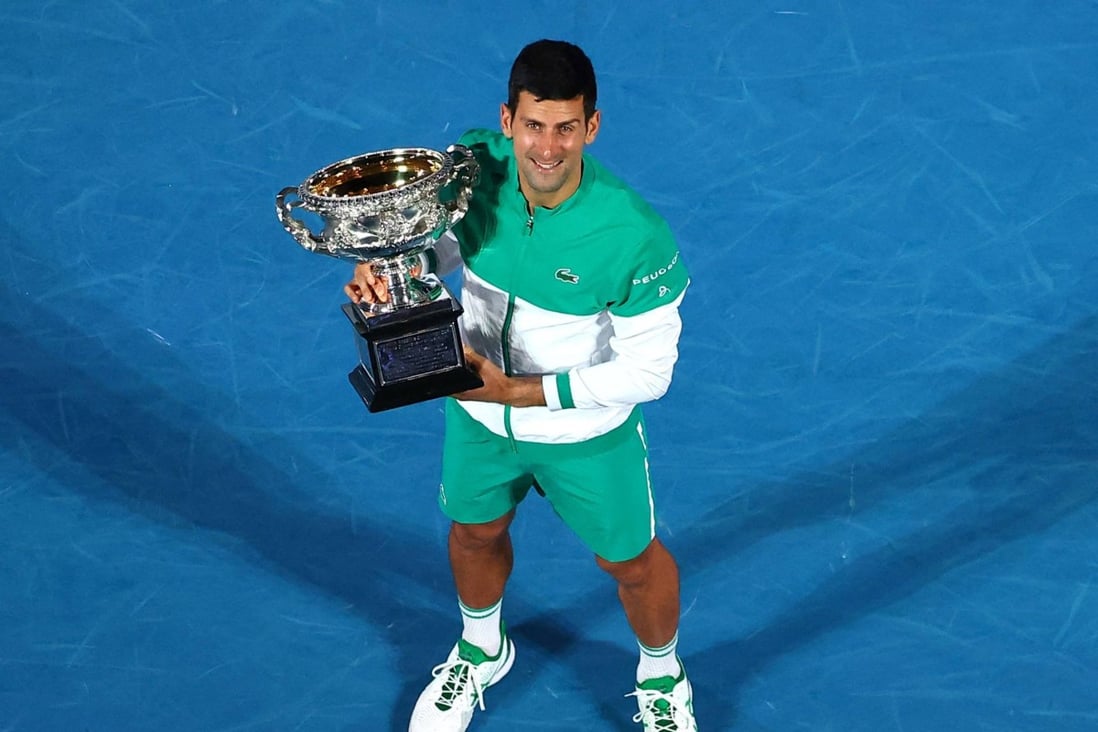 Novak Djokovic holds the Norman Brookes Challenge Cup trophy after beating Russia’s Daniil Medvedev to win the 2021 Australian Open. Photo: AFP