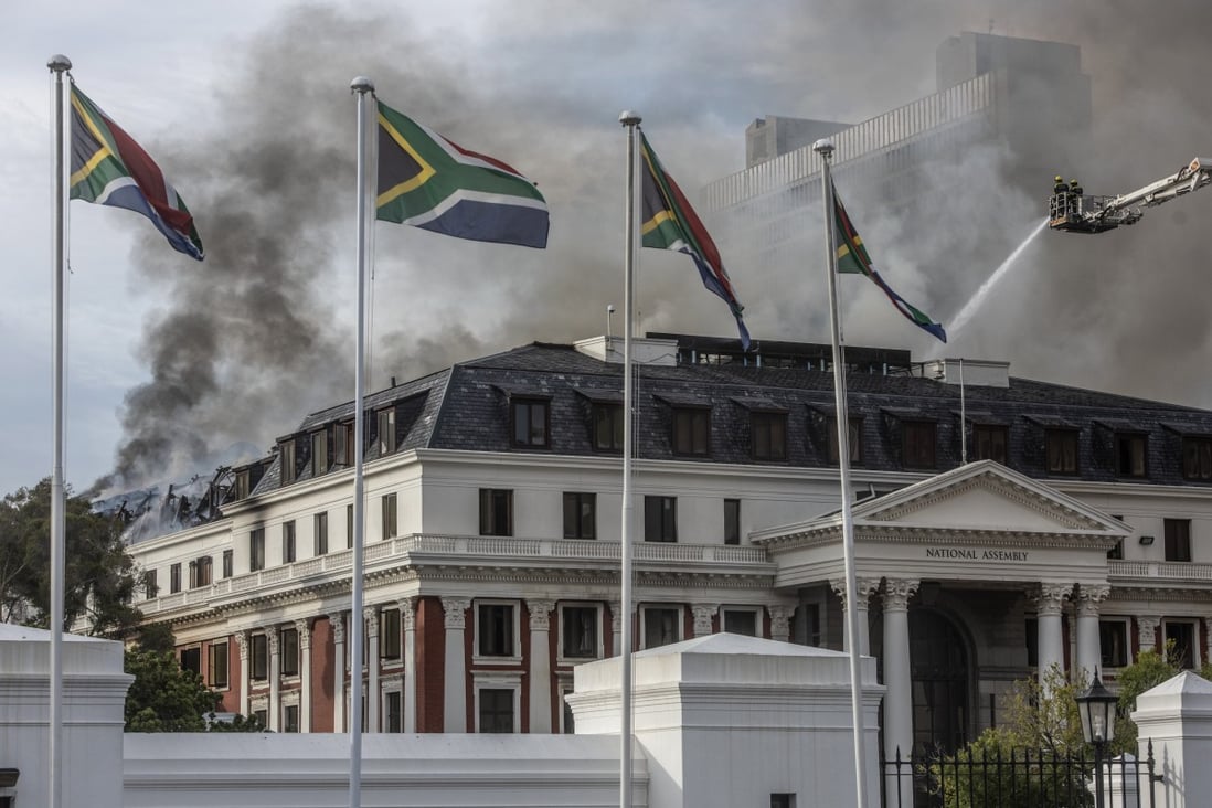 Firefighters battle a blaze on the roof of the National Assembly building in Cape Town, South Africa on January 3. Photo: EPA-EFE