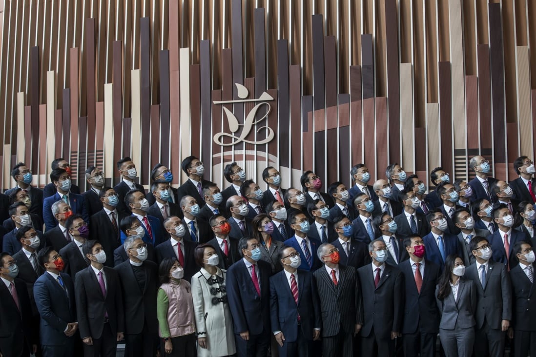 Hong Kong’s incoming lawmakers stand for photographs following an oath-taking ceremony at the Legislative Council on January 3. The seventh-term Legco is expected to help raise the standards of Hong Kong governance. Photo: Bloomberg