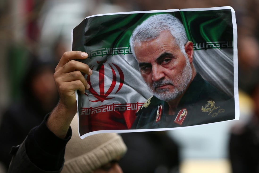 An Iranian holds a picture of Qassem Soleimani at a gathering to mourn the deceased general in Tehran, Iran, on January 4, 2020. Photo: Reuters