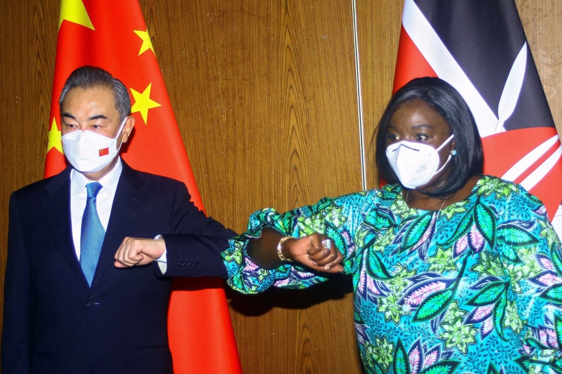 Chinese Foreign Minister Wang Yi and his Kenyan counterpart Raychelle Omamo bump elbows during a news conference in the coastal city of Mombasa, Kenya on Thursday. Photo: Reuters