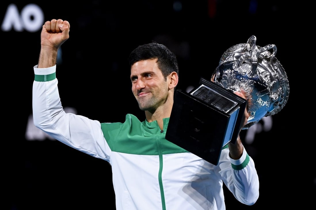 Novak Djokovic lifts the Norman Brooks Challenge Cup after winning the 2021 Australian Open. Photo: EPA