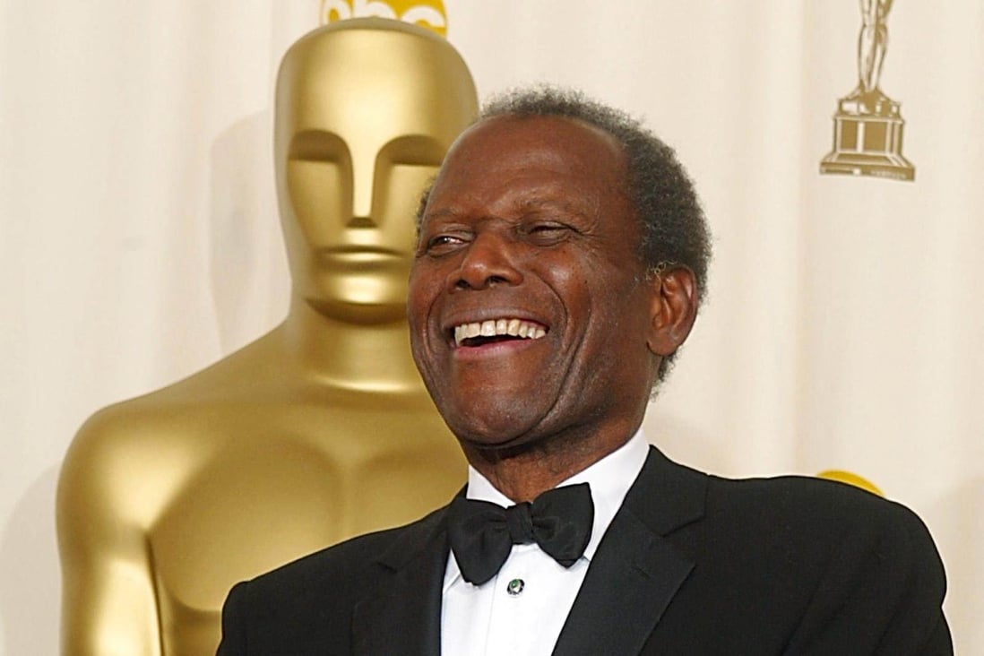 US actor Sidney Poitier holds his honorary Oscar at the 74th Academy Awards in Hollywood in March 2002. Photo: AFP
