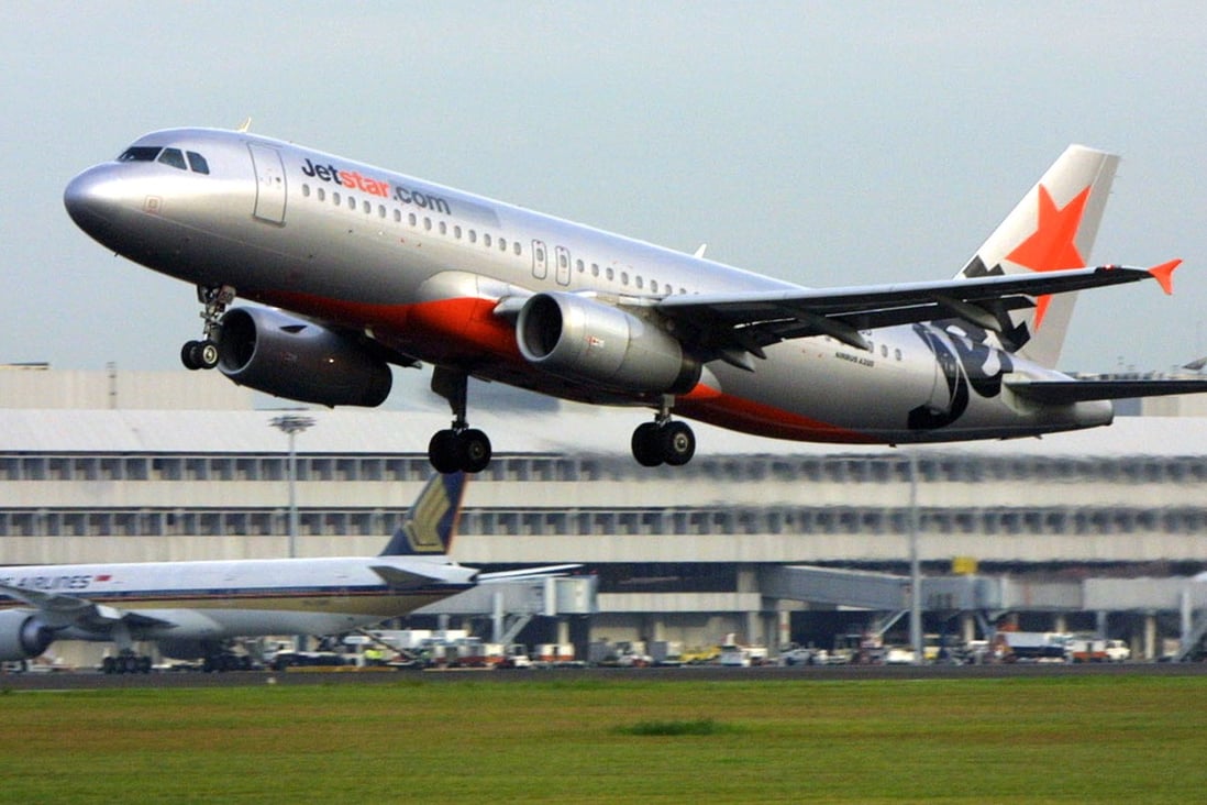 A JetStar passenger plane takes off from the runway at Changi International Airport in Singapore. Photo: AFP