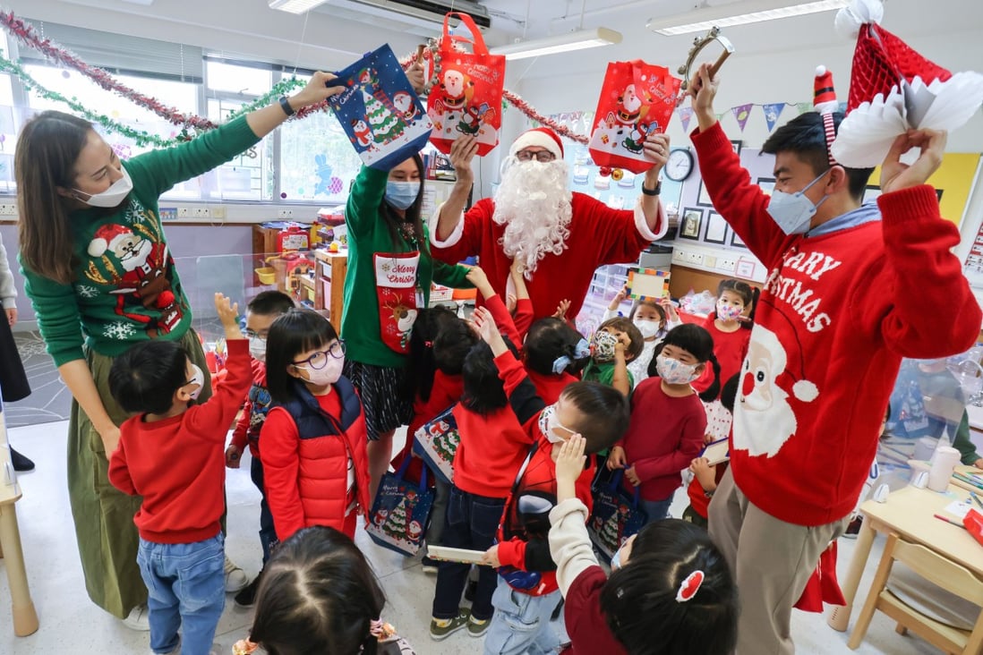 Korean International School Hong Kong principal Christopher Chadwick (as Santa) celebrates Santa Fun Day last month at the school in Sai Wan Ho. Photo: May Tse