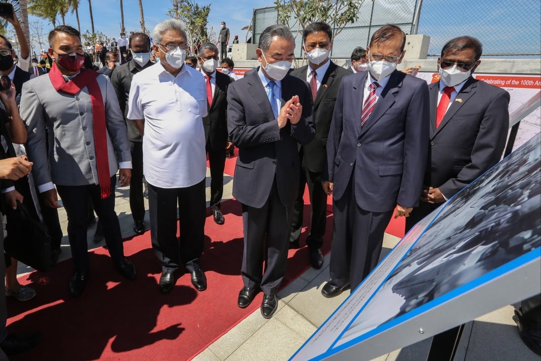 Sri Lankan President Gotabaya Rajapaksa (second left) and Chinese Foreign Minister Wang Yi (centre) inspect the Port City project in Colombo. Photo: EPA-EFE