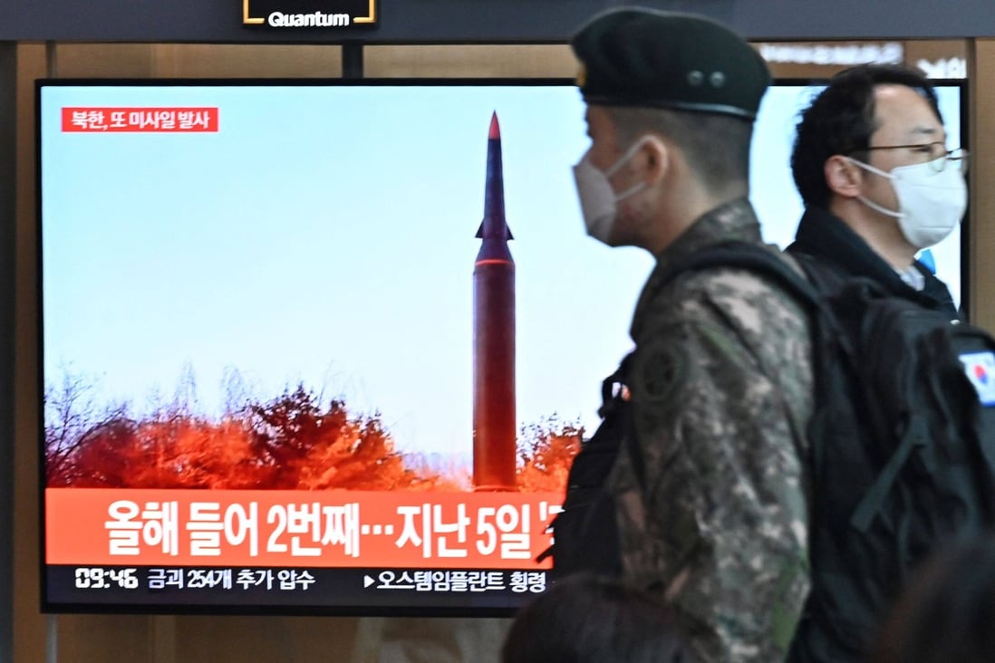 People walk past a television showing a file image of a North Korean missile launch at Seoul Railway Station in South Korea on Tuesday. Photo: AFP