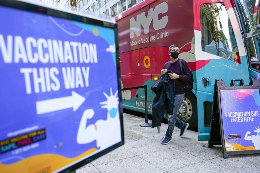 A man leaves a vaccination bus at a mobile clinic in New York in December. Photo: AP