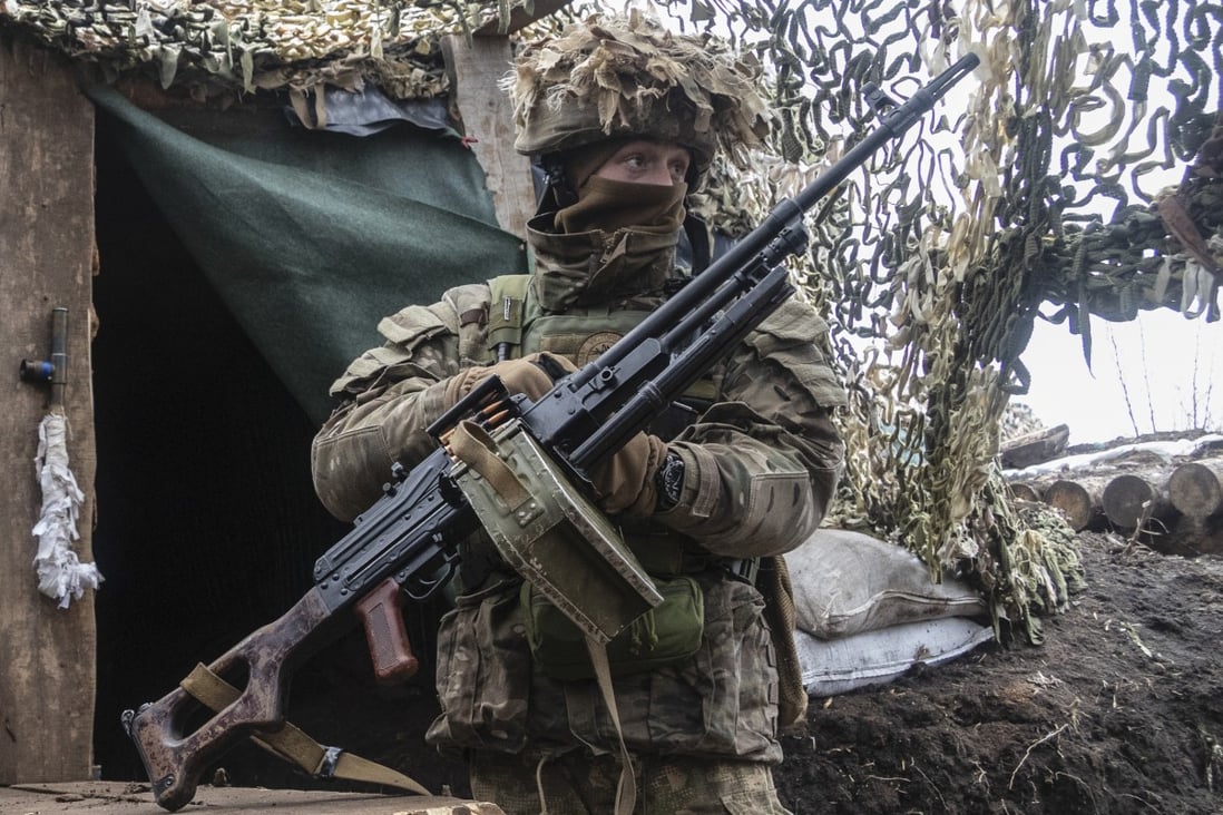 An Ukrainian soldier stands at the line of separation from pro-Russian rebels in the Donetsk region on Monday. Photo: AP