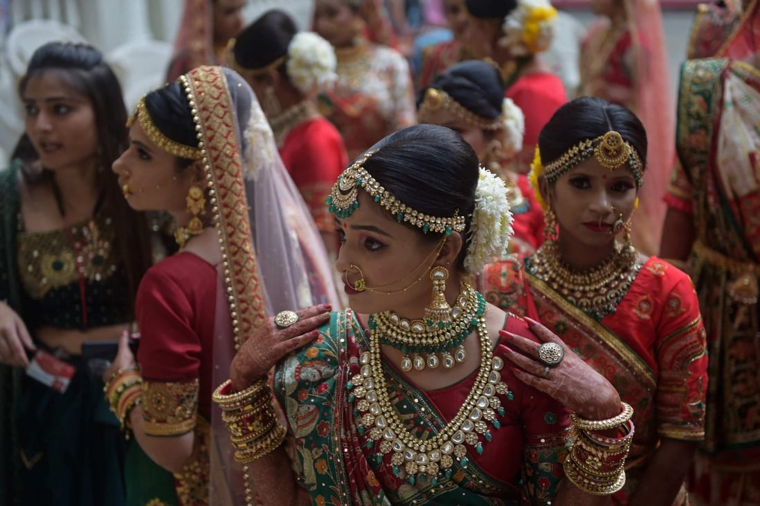 Hindu brides gather as they wait to participate in a mass marriage ceremony in India’s Gujarat state in December. Photo: AFP