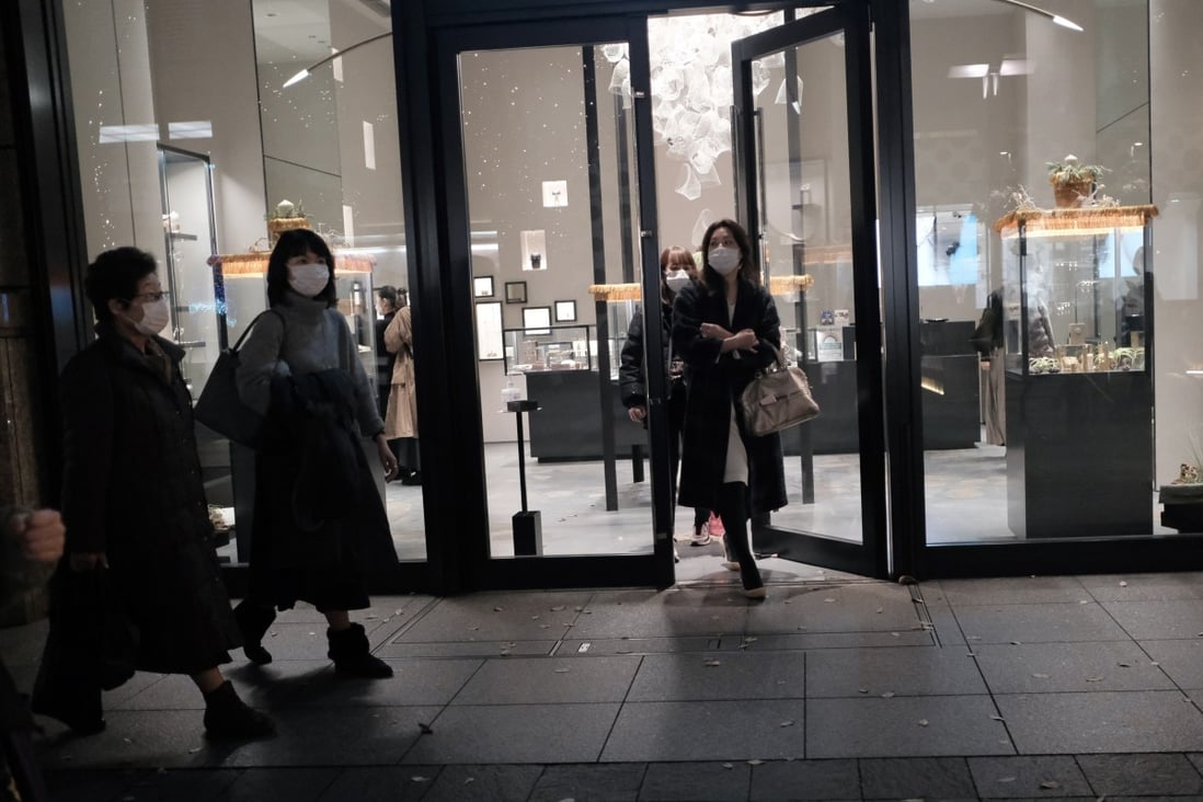 Shoppers exit a jewellery store in Tokyo. Some premium goods are bucking a deflationary trend that has defined Japan for decades. Photo: Bloomberg