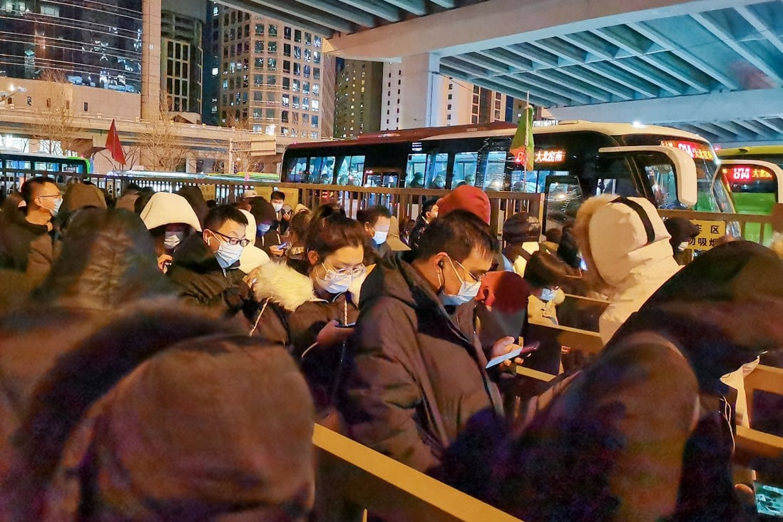 Queues snake around Guomao’s bus terminal in central Beijing as commuters wait to head home to Yanjiao. Photo: Echo Xie