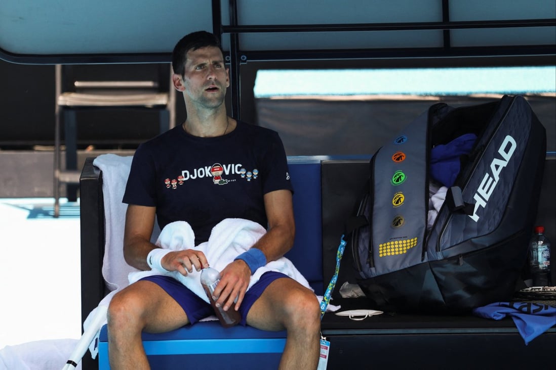 Novak Djokovic rests at Melbourne Park as questions remain over the legal battle regarding his visa. Photo: Reuters
