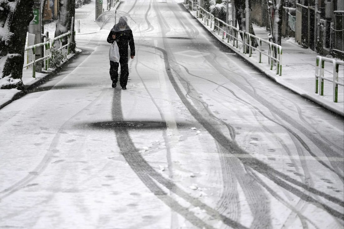 An elderly man walks along a street covered with snow in Tokyo. A growing trend of elder abuse in Japan has raised concerns for the rest of ageing Asia. Photo: EPA