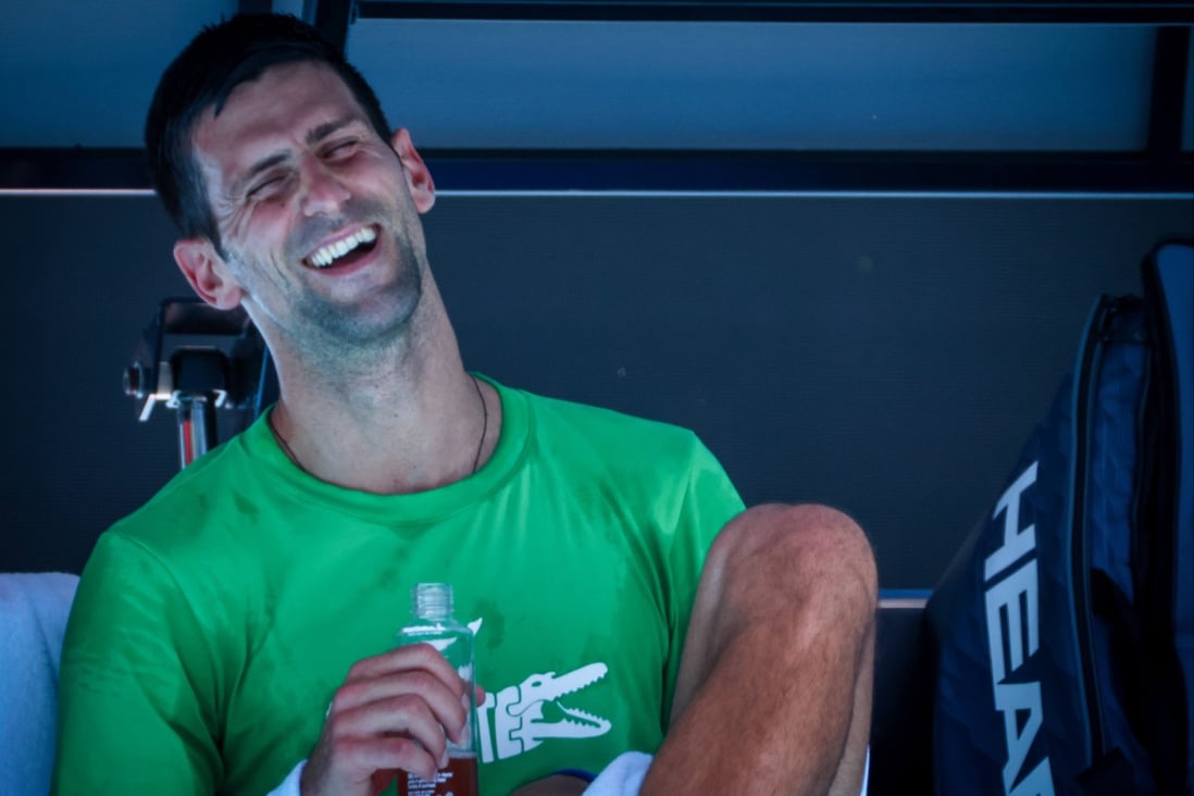 Novak Djokovic laughs during a training session ahead of the Australian Open at Melbourne Park. Photo: Patrick Hamilton/BELGA/dpa