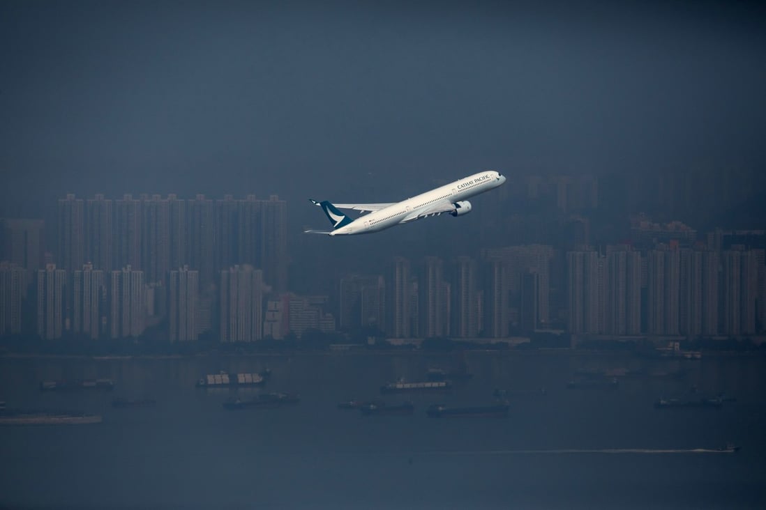 A Cathay Pacific aircraft takes off from Hong Kong International Airport on January 6. As the pandemic persists, the blow to the Hong Kong economy may well be mortal without a plan for comprehensive vaccination and international cooperation enabling resumption of safe travel. Photo: Bloomberg