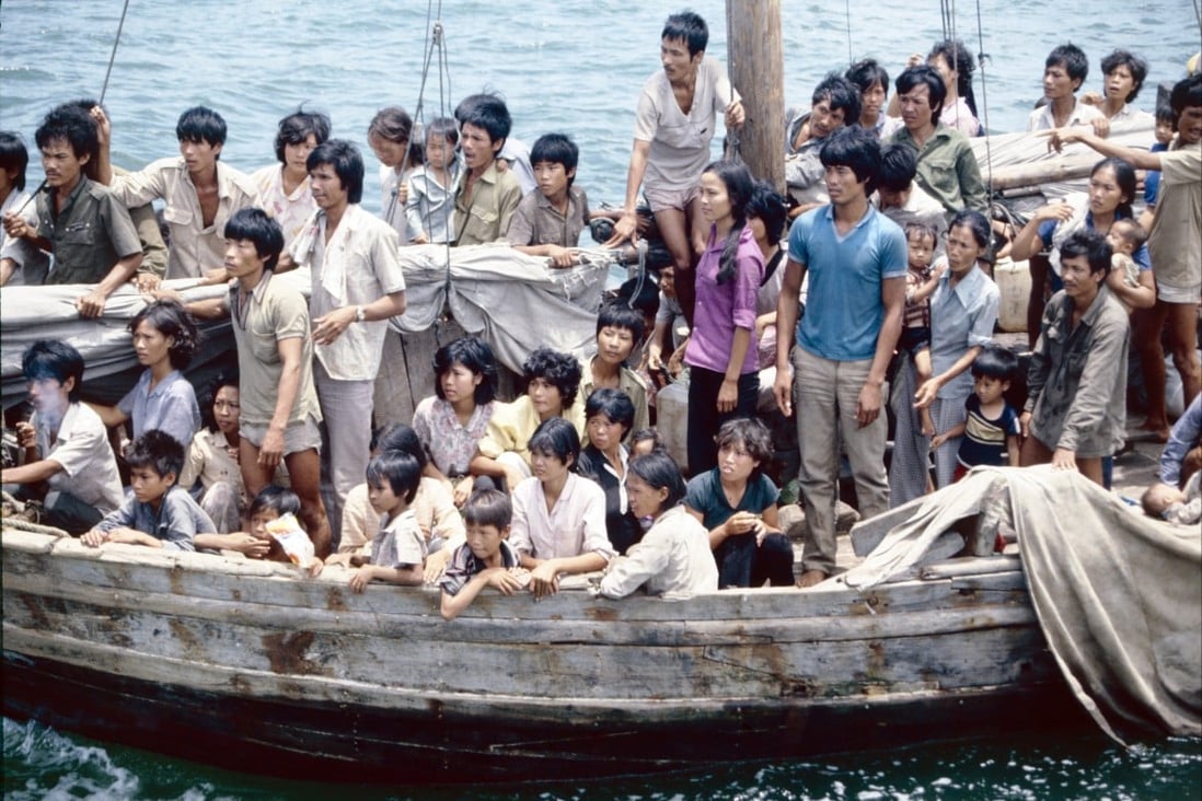 Vietnamese refugees arrive in Hong Kong. Some are wearing green or khaki shirts from the Vietnamese military. 