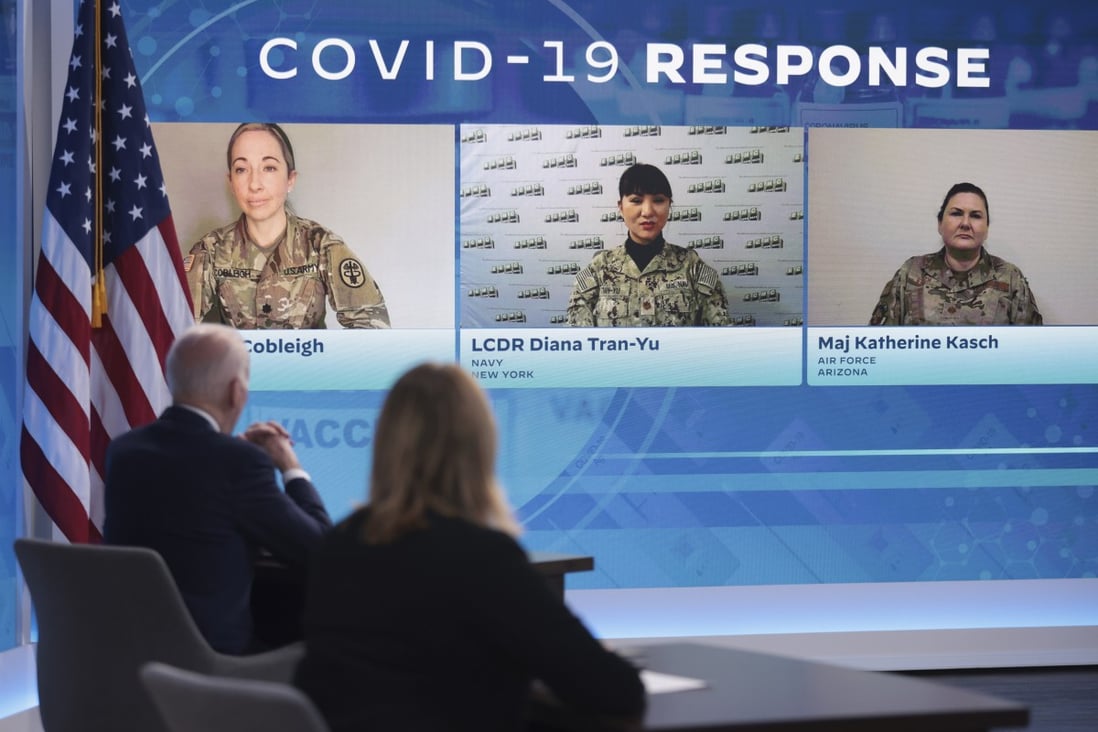 US President Joe Biden (left) speaks on his administration’s Covid-19 surge response as members of the military from Arizona, New York and Michigan listen on a screen in Washington on Thursday. Photo: Bloomberg