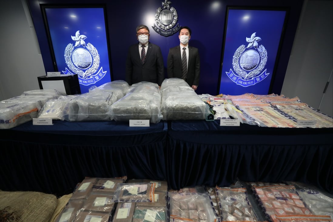 Superintendent Chan Kong-ming (left) and Senior Inspector Ng Ka-lun of the narcotics bureau with the drugs seized during the raids on Tuesday and Wednesday. Photo: Xiaomei Chen