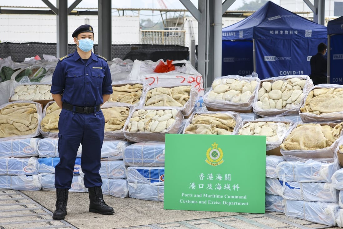 Customs official shows more than 50 pallets of smuggled frozen meat seized in Thursday’s operation. Photo: Dickson Lee
