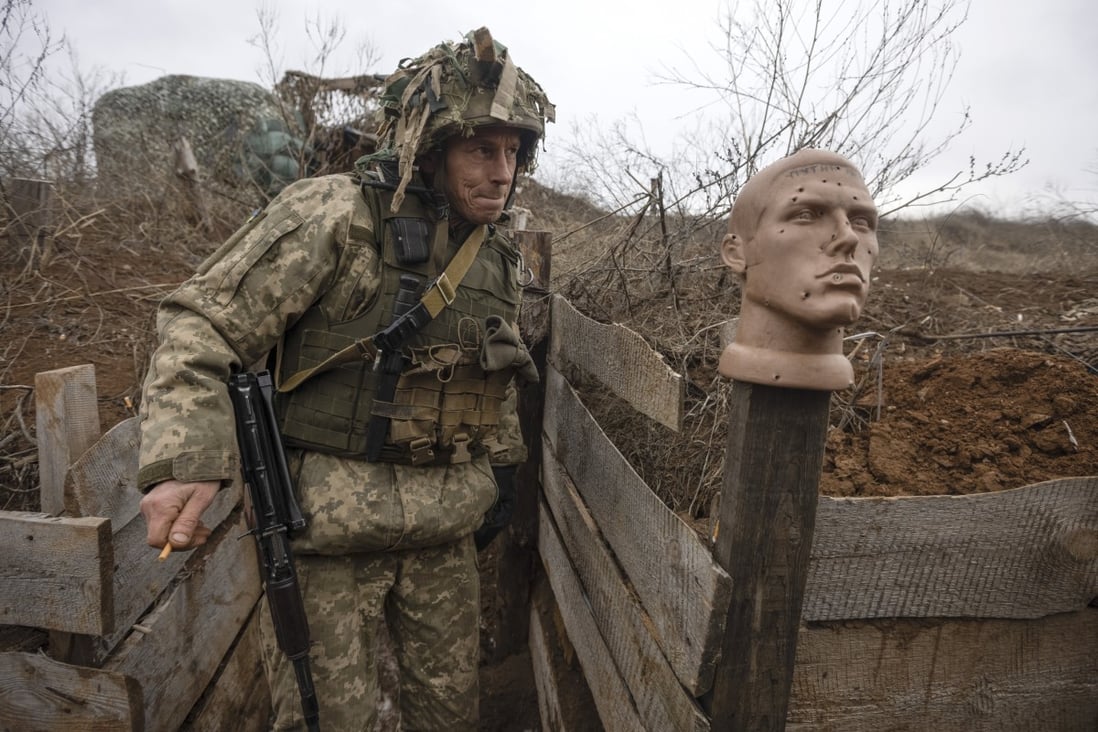 A Ukrainian soldier walks in a trench at the line of separation from pro-Russian rebels, in the Donetsk region, Ukraine. Photo: AP
